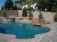 <b>Brown Granite Ecostone Simtek Fence surrounding pool</b>